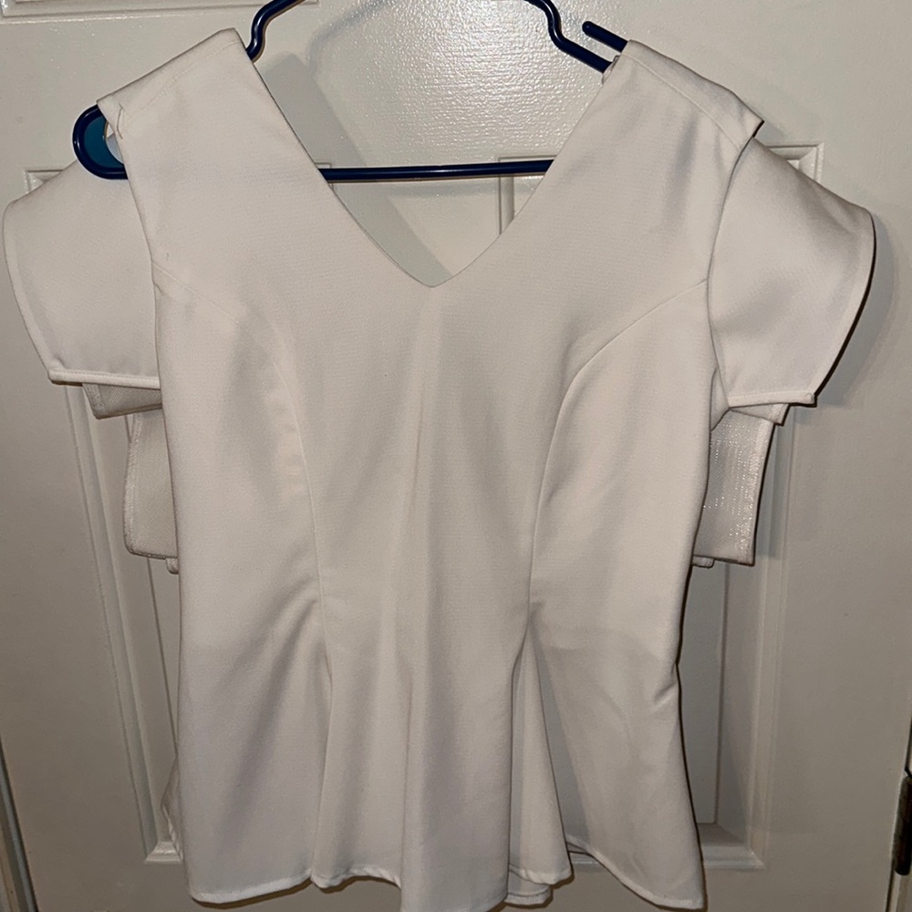 Fashionable white peplum blouse